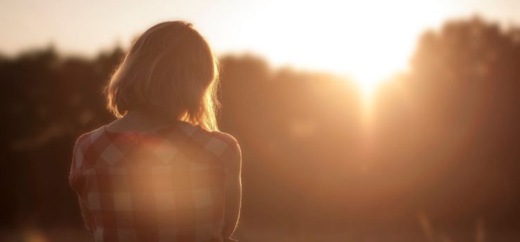 The Art of Slowing Down woman enjoying sunset
